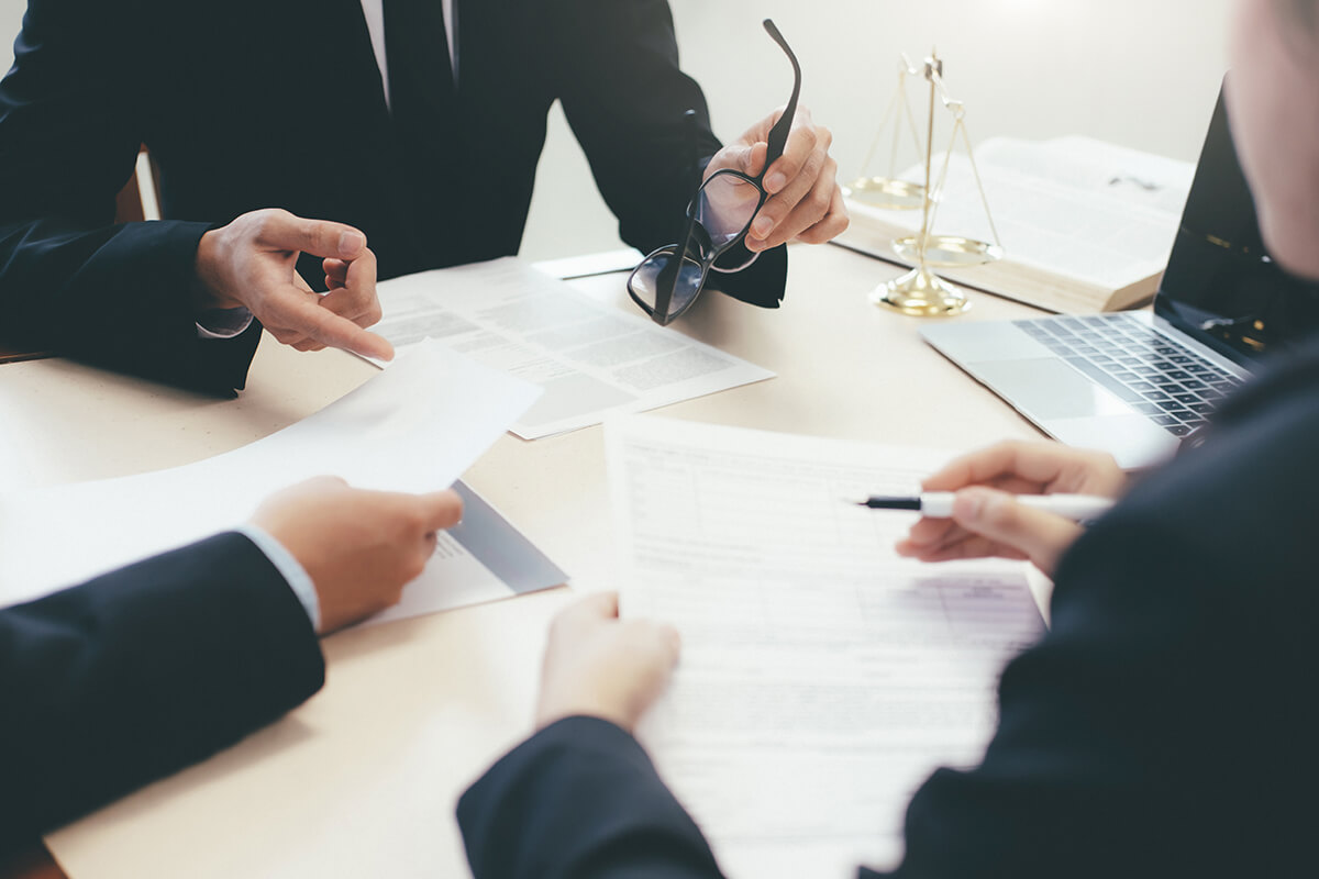 Lawers in a Meeting - Barnes and Fersten Law Firm